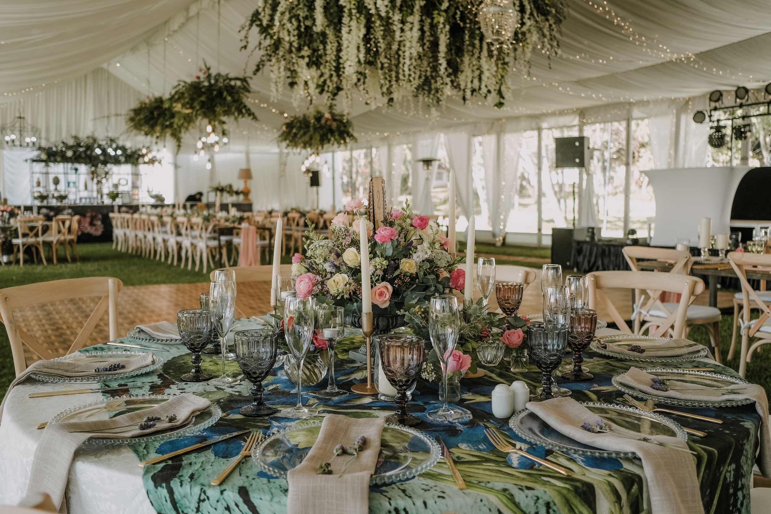 A Flowers and Wine Glasses on the Table